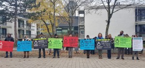 Reclaim Power's eight demands outside the entrance to COP 23